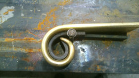 Brass handrail section produced from a metal die