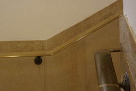 Patinated replica wall bracket copied from a surviving original