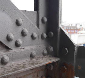 Trial cleaning to a wrought iron lattice panel