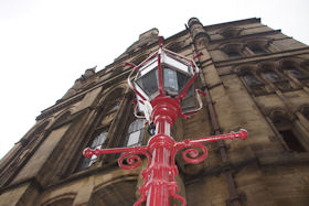 Restored cast iron lamp post with a replica copper gas style lantern head